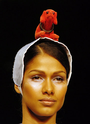 Not to be utdone, Rahul Anand thinks women need quirky head dresses too. Remember these bobbing head dogs that used to be in cars?