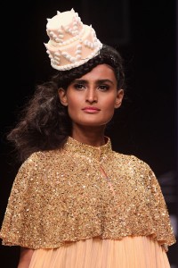 In honor of Kim Kardashian's wedding cake, which will be created by the same designer as Kate and William's, Lakme Fashion Week featured cake hats on the runway. Yes, Kris Jenner arranged this as well.